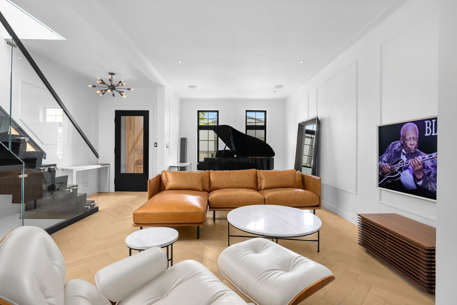Bright interior with lounge chairs and wood flooring
