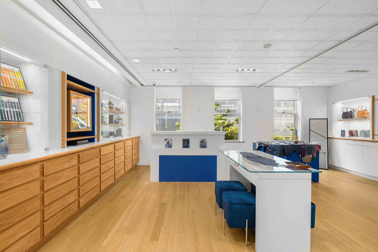 Showroom interior with wood floors and blue seating